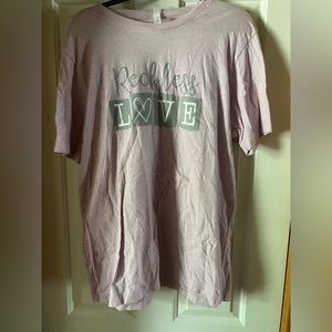 Purple Bella Canvas shirt says Reckless Love